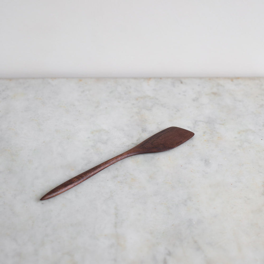 https://www.elleihome.com/cdn/shop/products/INGREDIENTS_LDN_hand_carved_wooden_black_walnut_cooking_spatula-4_1000x1000.jpg?v=1628692104